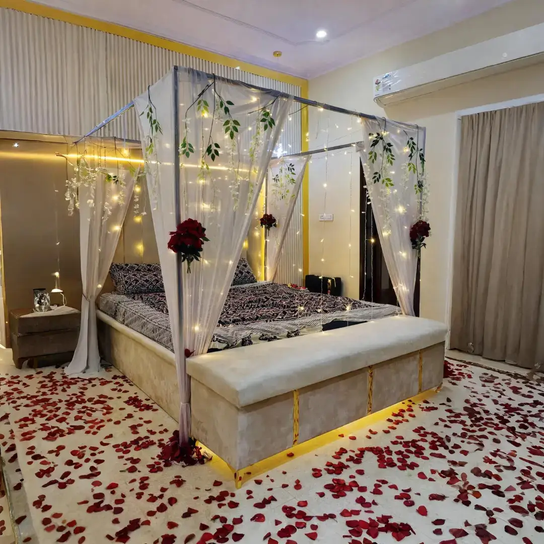 Canopy bed decorated with fairy lights and rose petals